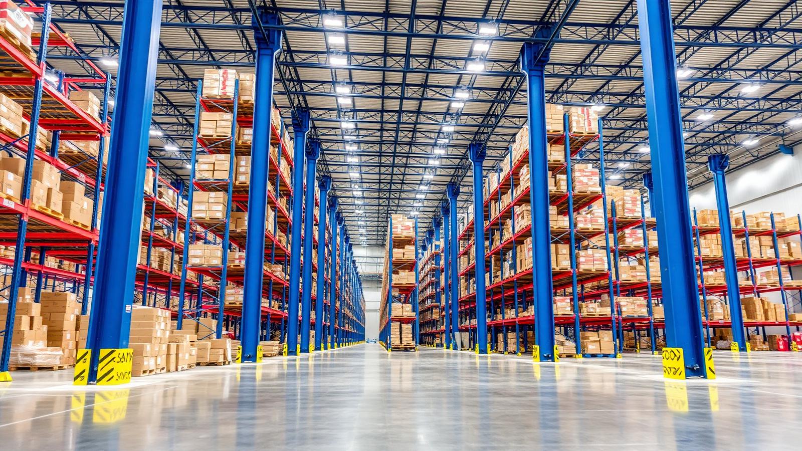 Interior of a large distribution warehouse with tall racking